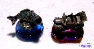 Lot of Two Miniature Figurines on a Colored B...