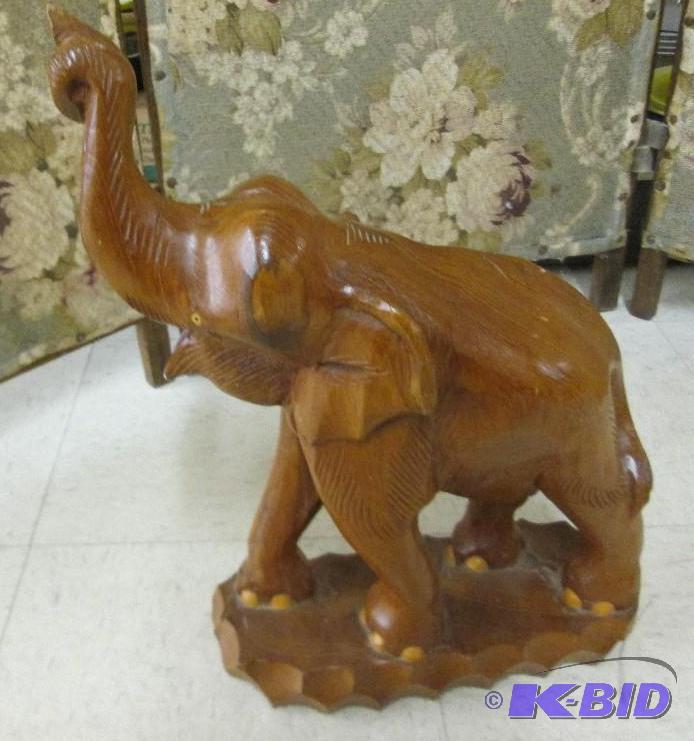 lot 122 image: Carved wood elephant, trunk was repaired...