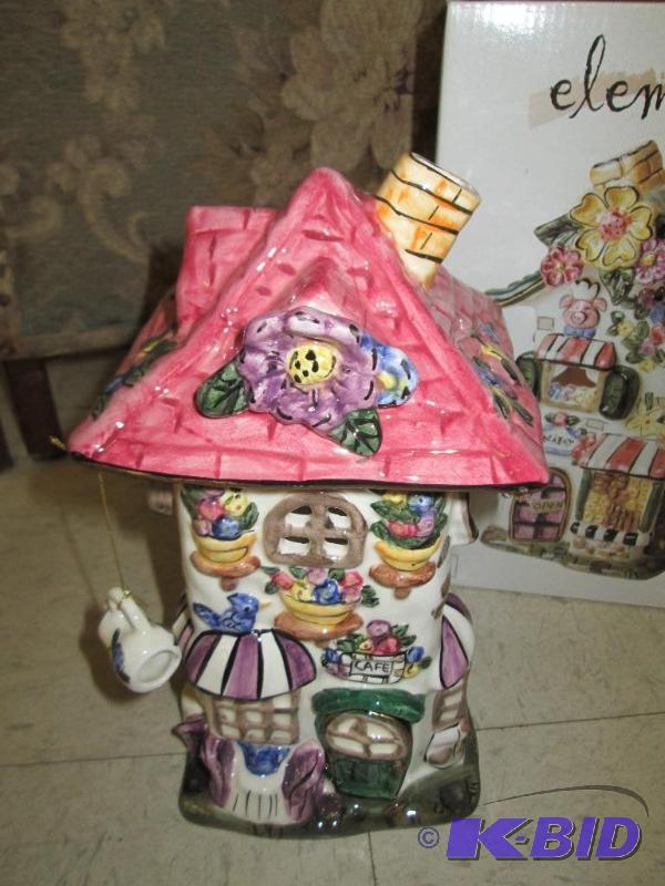 lot 128 image: Elements Village House tealite holder...