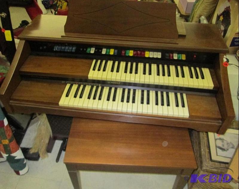 lot 28 image: Lowery electric organ with bench...
