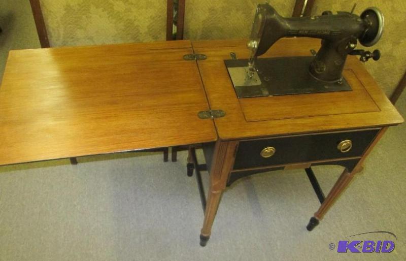lot 40 image: New Home antique sewing machine on stand...