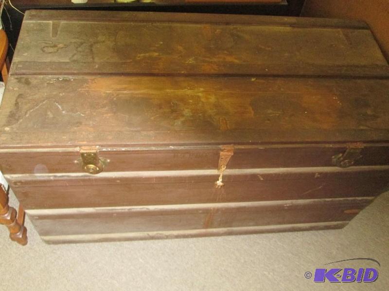lot 63 image: Large wood trunk with keyed lock and latches,...