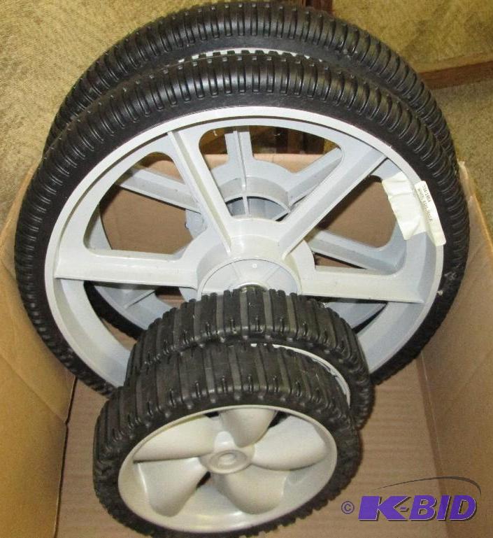 lot 79 image: New lawn mower wheels...