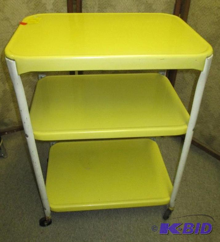 lot 90 image: Vintage yellow rolling cart, 22 x 16 inch top...