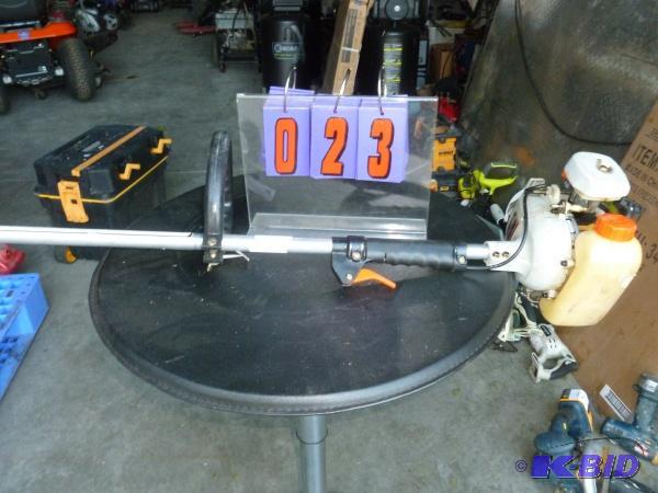lot 23 image: Echo gas trimmer. Used condition. Has compres...