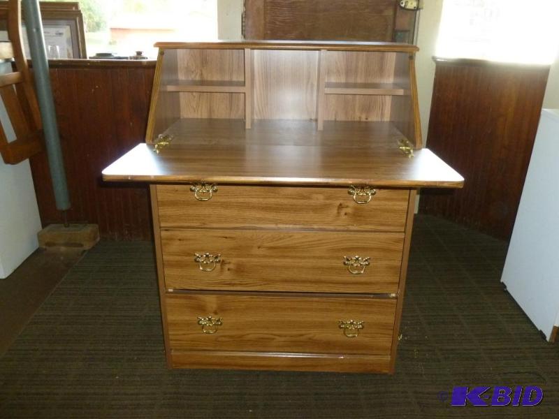 lot 12 image: Nice three drawer drop down wood laminate sec...