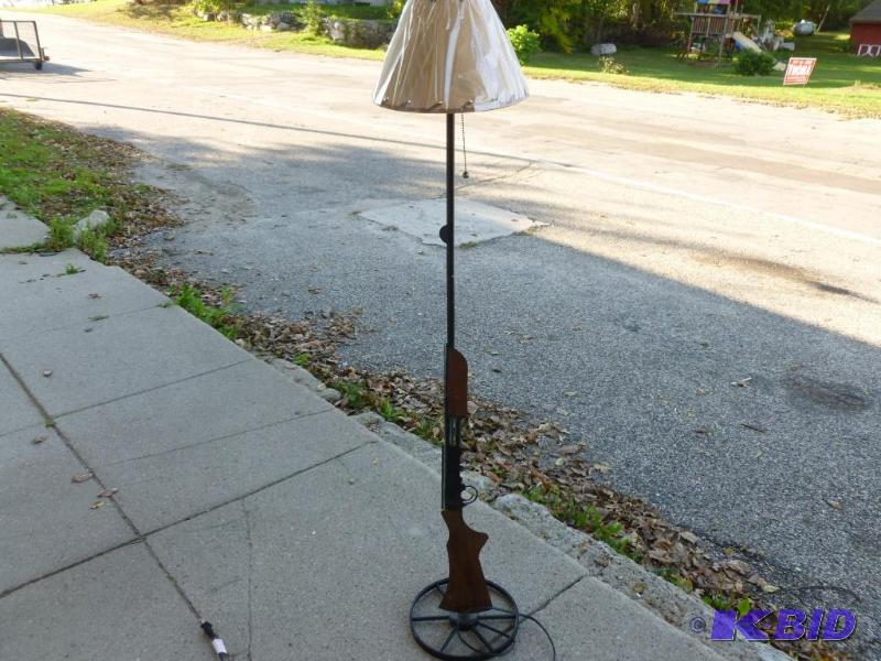 lot 27 image: Nice cut metal shotgun floor lamp that measur...
