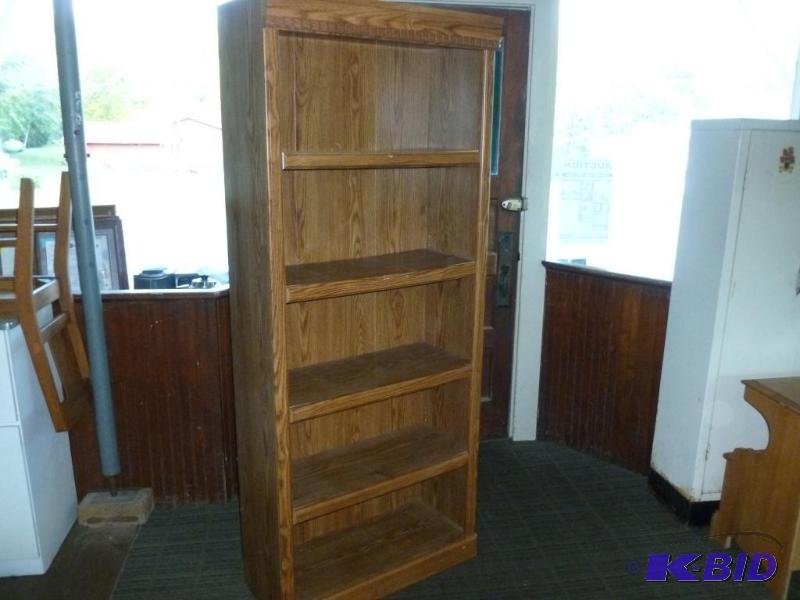 lot 7 image: Nice four tier wood laminate book shelf that ...