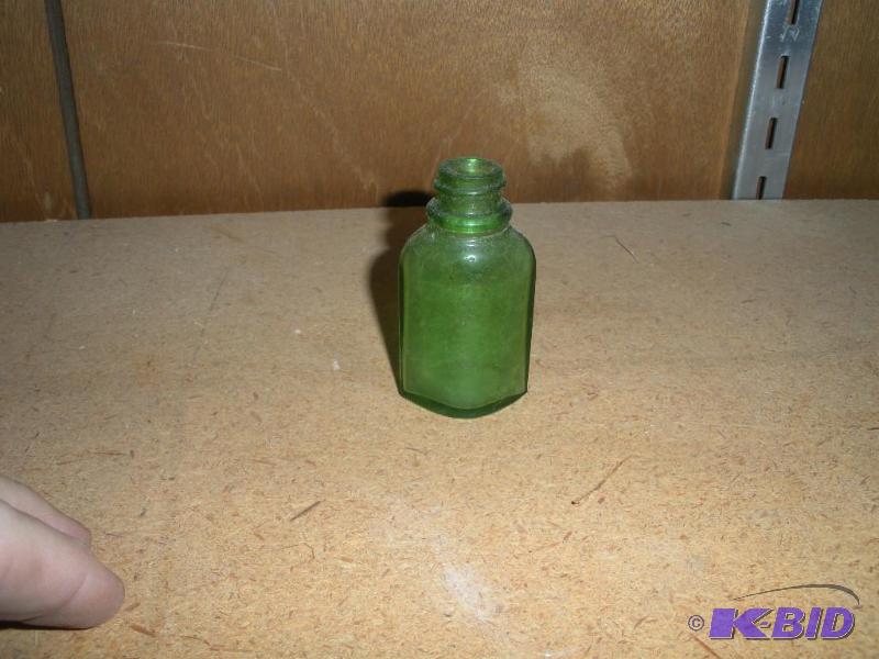 lot 016 image: Green Depression Glass Medicine Bottle