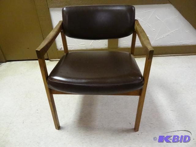 Leather look chair with solid walnut frame. B...