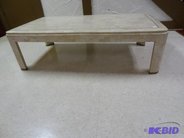 Tessellated stone coffee table with brass leg...