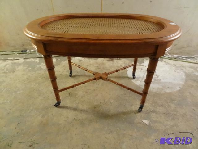 Oval faux bamboo coffee table with brass cast...