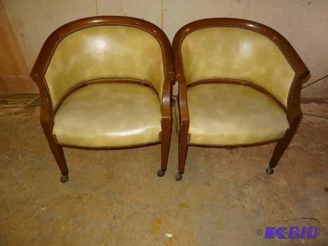 Pair of solid wood tub chairs. On casters. Vi...