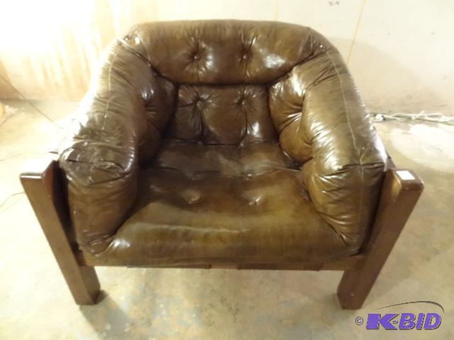1970s brown vinyl tuffed lounge chair with s...
