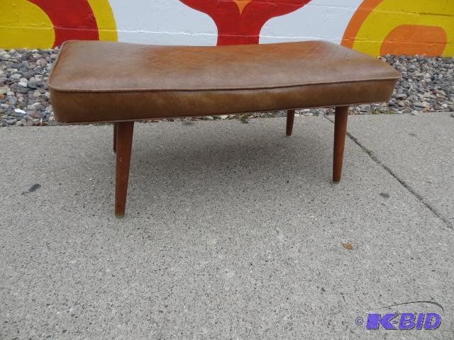 Brown vinyl bench with angled taper legs. Goo...