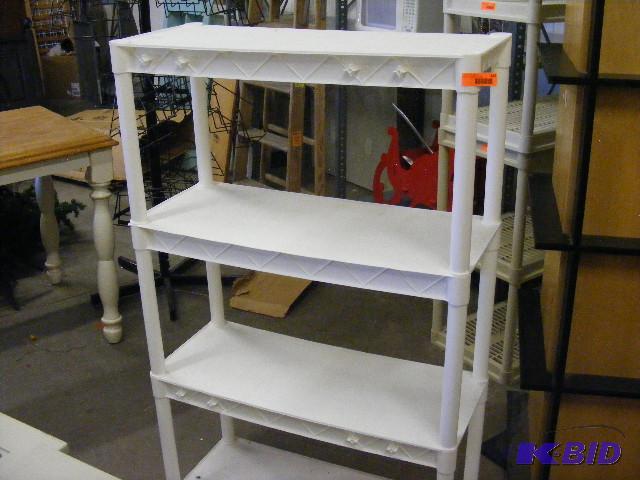 white plastic shelving unit. 56 tall x 34...