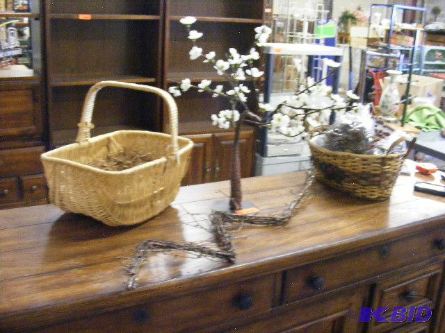 Two baskets with pine cones, flowered tree an...