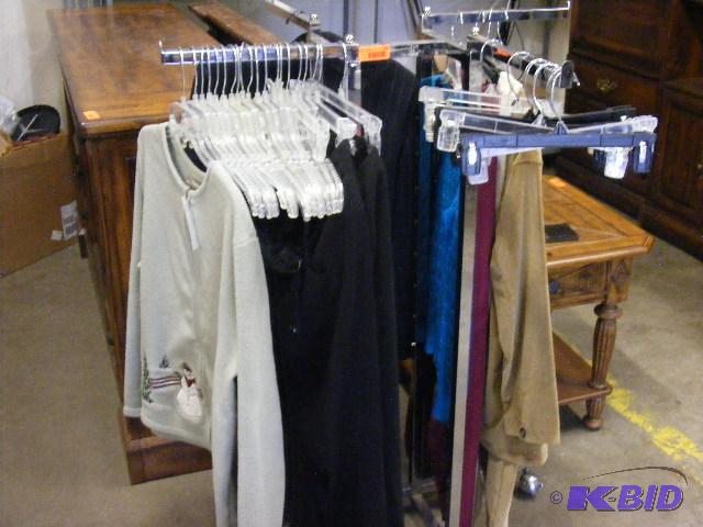 Display rack with hangers and clothes include...
