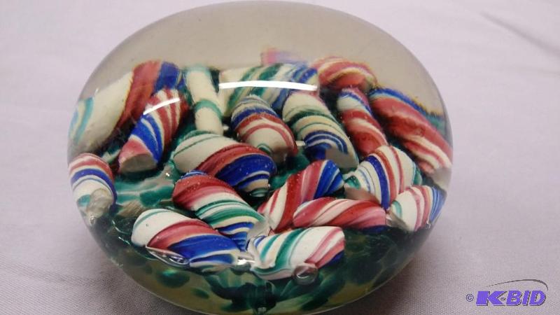 Blown glass paper weight smaller than basebal...