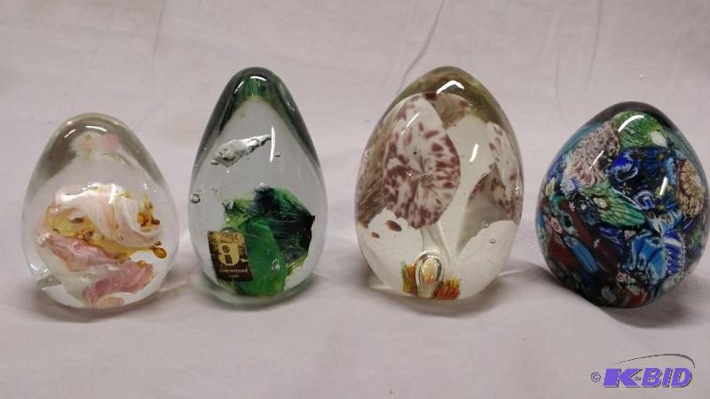 A lot of 4 egg shaped paper weights, one hand...