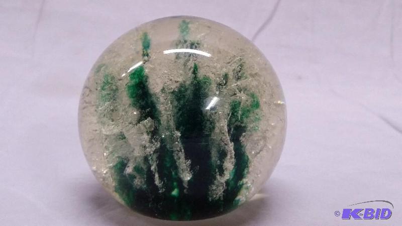 Paper weight the size of a baseball fells lik...
