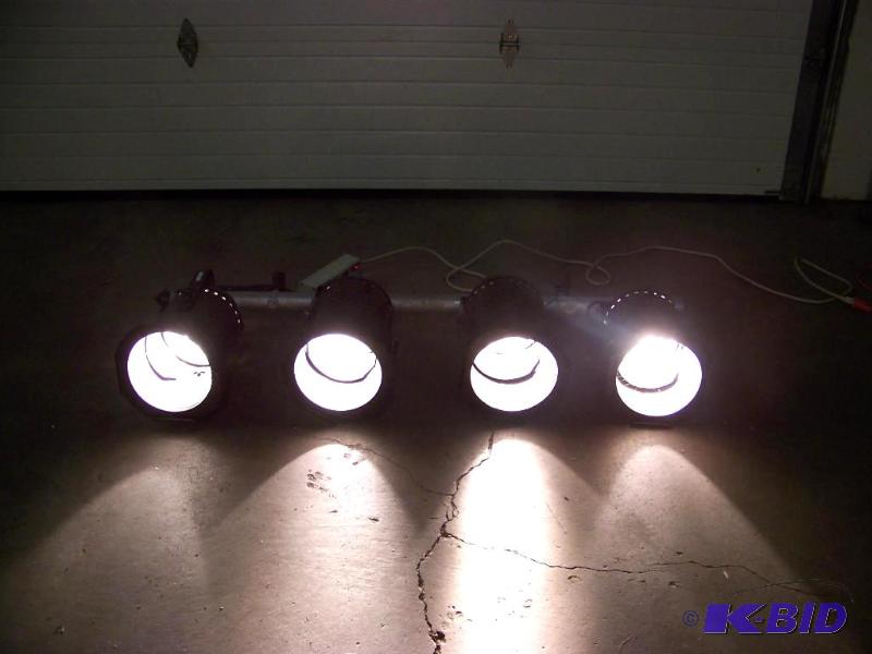 lot 31 image: (4) Studio Lights, mounted on a hanging bar with clamps