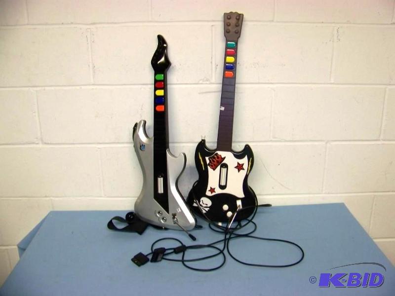 lot 26 image: (2) Rock BandGuitar Hero Guitars