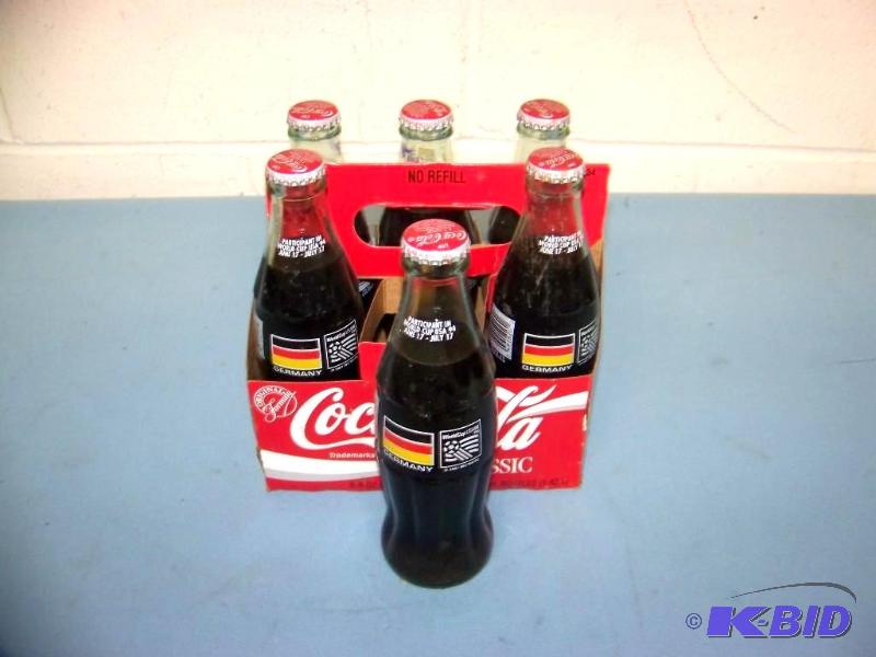 lot 7 image: Collectible, Coca-Cola, Germany, 1994 World Cup Soccer, 6 Pack of Bottles and Holder