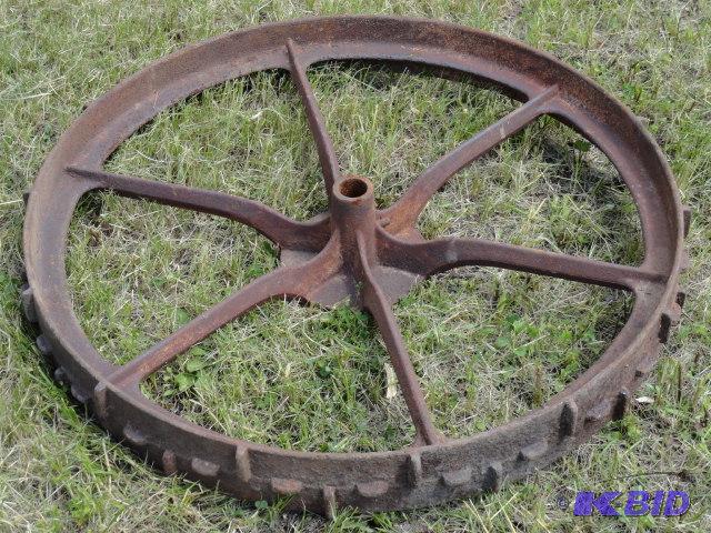 lot 27 image: Heavy cast iron wheel, 34"...
