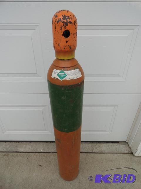 lot 77 image: Argon tank with cap, not empty...