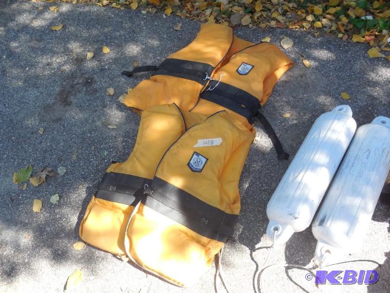 lot 148 image: 4 life jackets and 2 dock bumpers...