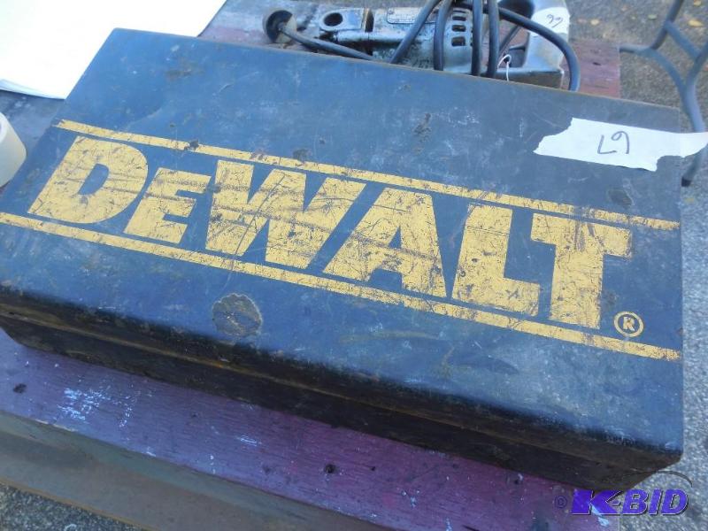 lot 67 image: Dewalt hammer drill with bits, needs brushes...