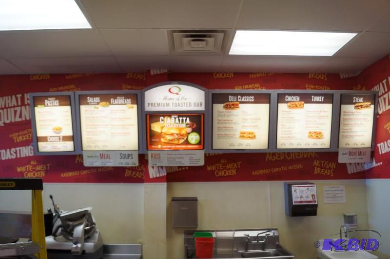 lot 56 image: overhead menu sign