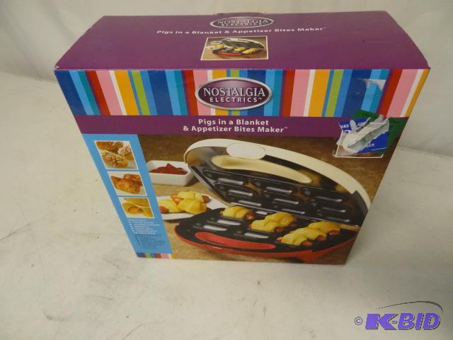 lot 111 image: Pigs in a blanket maker. NIB...
