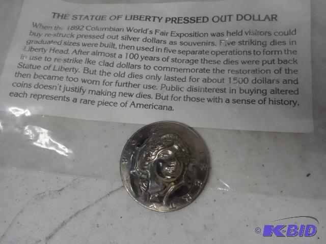 lot 201 image: Pressed liberty silver dollar...