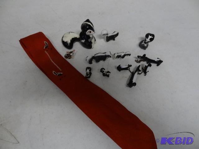 lot 50 image: Skunk tie and ceramic figurines...