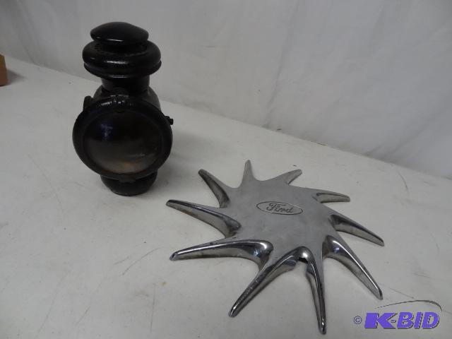 lot 64 image: Model T light. Ford hubcap...