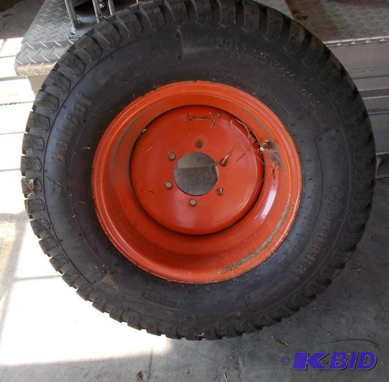 lot 16 image: Bobcat Tire and Rim Size 29" x 13.5"...