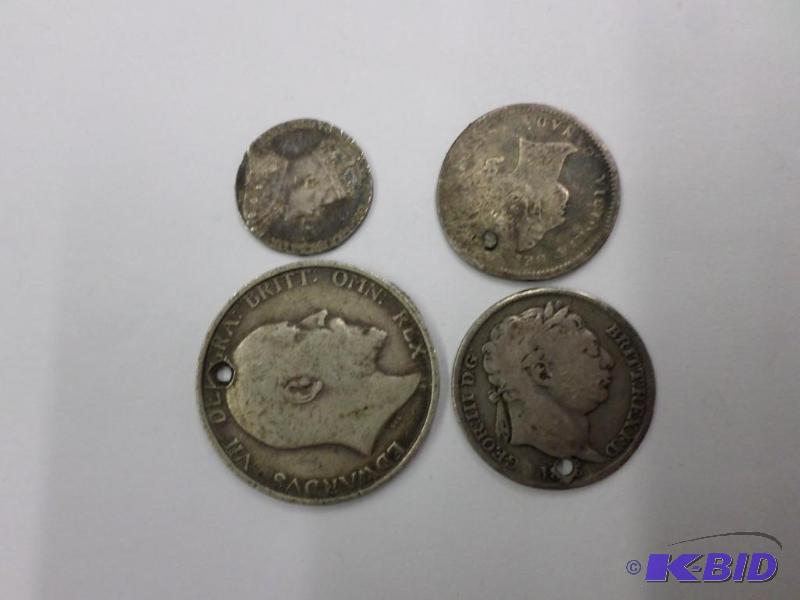 4 damaged silver foreign coins...