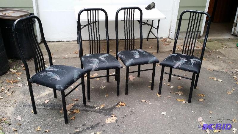 Set of four black metal chairs with black cus...