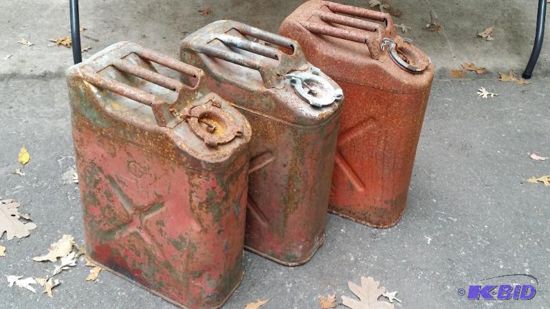 Three vintage gas cans. Rusted closed...