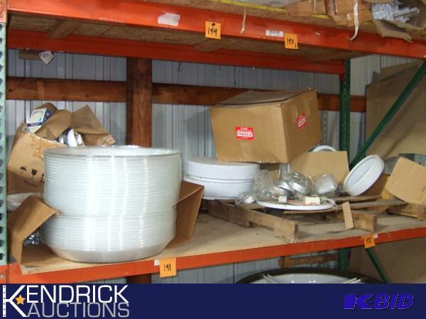 Shelf Full of Dome Covers, Diffusers, and Other Industrial Lighting Parts