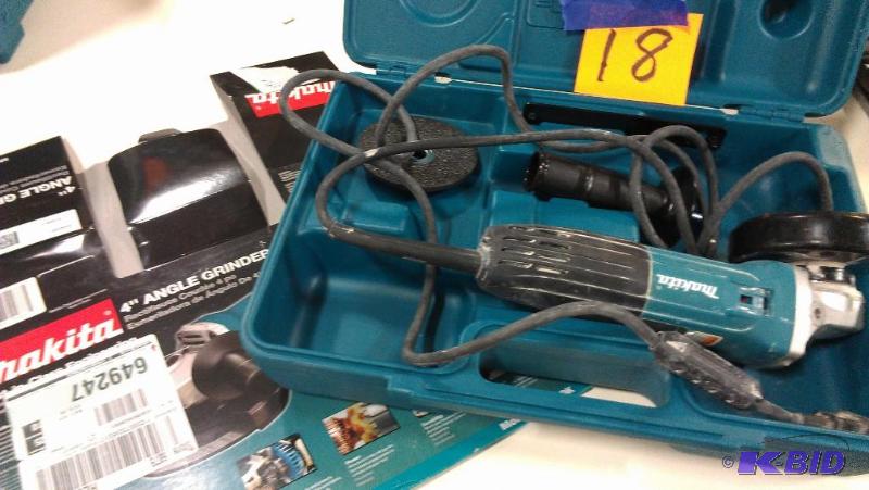 lot 18 image: Makita 4" Angle Grinder. The ON switch i...