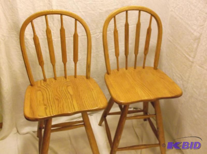 lot 22 image: Pair of Tell City solid oak bar stools with s...