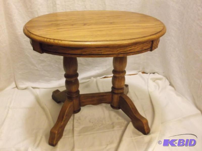 lot 26 image: Beautiful oval solid oak end table measuring ...