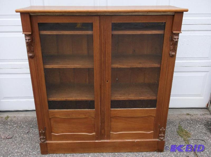 lot 4 image: Antique solid oak book case with lion faces m...