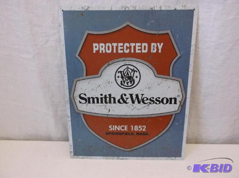 lot 54 image: Collectable metal Smith & Wesson sign mea...