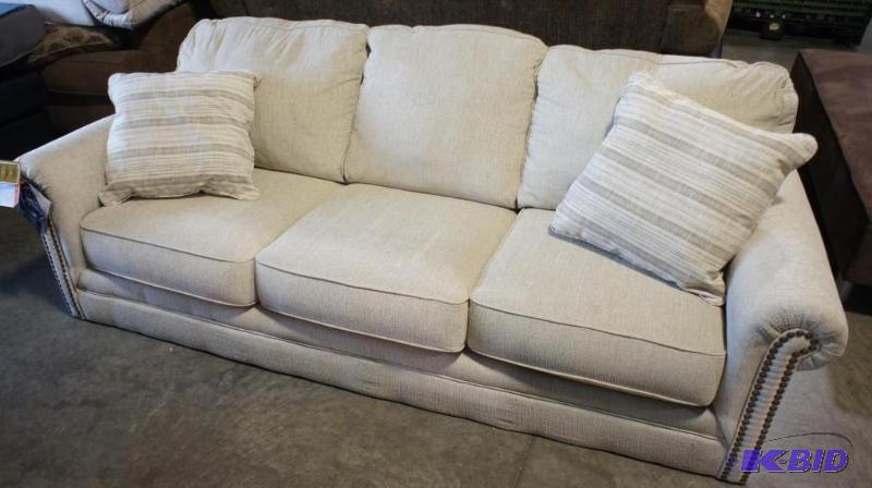New Ashley Signature Sofa. Cream in color. Di...