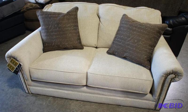 New Ashley Signature loveseat. Cream in color...