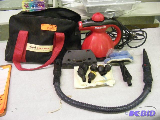 lot 612 image: Scunci Steamer, with accessories and storage ...